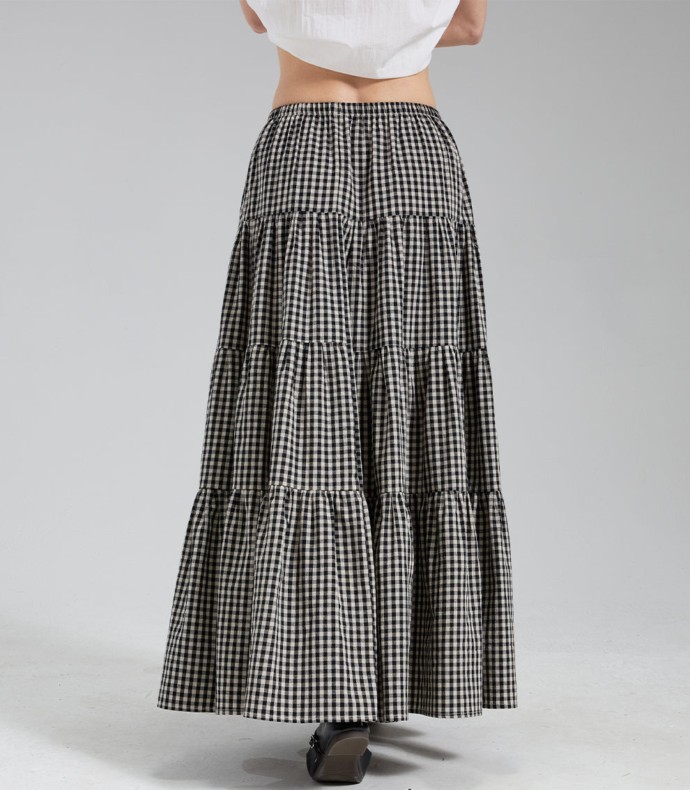 Back view of flowy vintage plaid cotton maxi skirt, highlighting the comfortable elastic waist and tiered design.