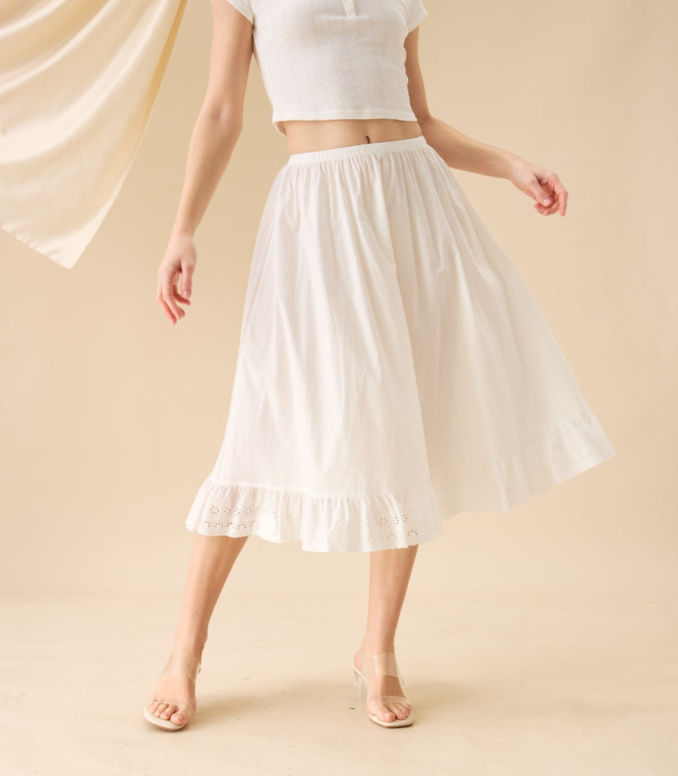 Model twirling in the white half slip. A versatile, static-free 100 percent cotton half slip for classical layering