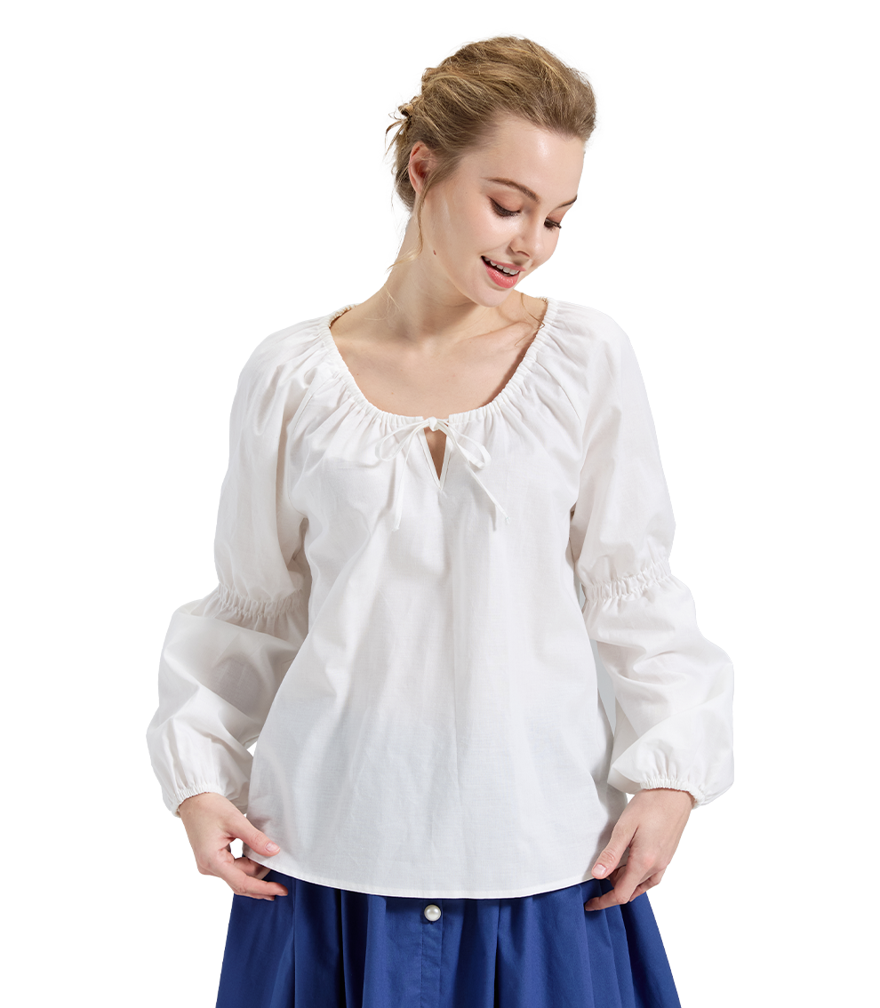 Ivory Renaissance style peasant blouse with a tie neck, featuring a model looking down.