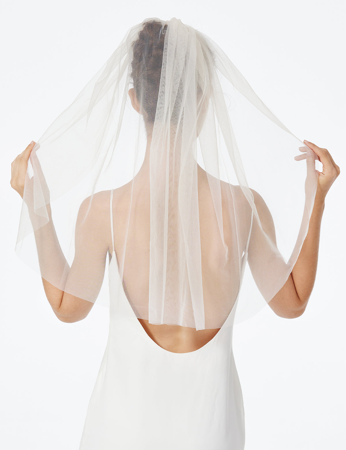 Bridal veil with ready-to-wear comb attachment showing easy styling for wedding day