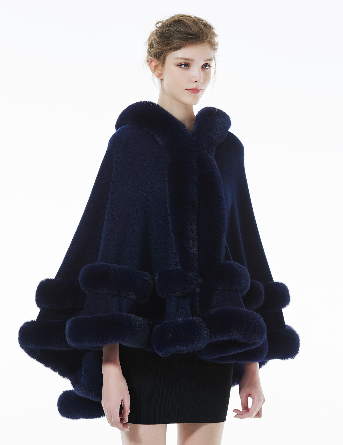Model wearing darkblue hooded knit cape - front styling view showing elegant drape and fit