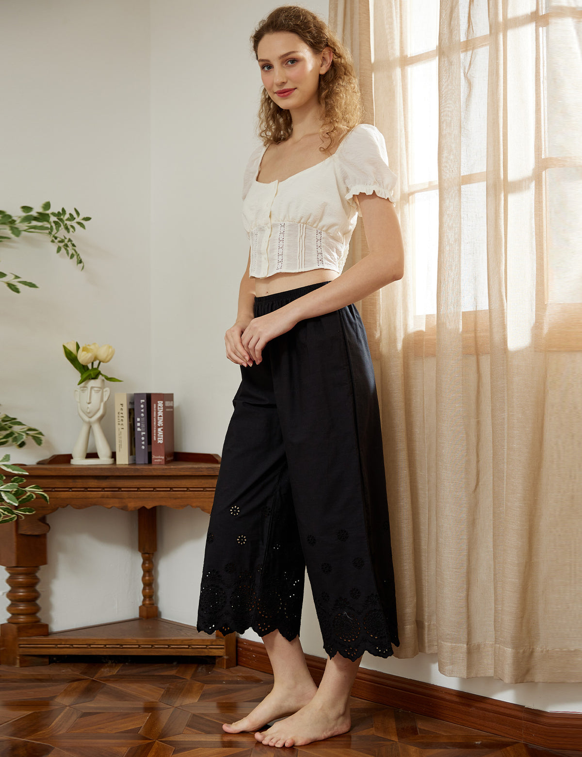 black cotton cropped sleep shorts displaying wide leg design
