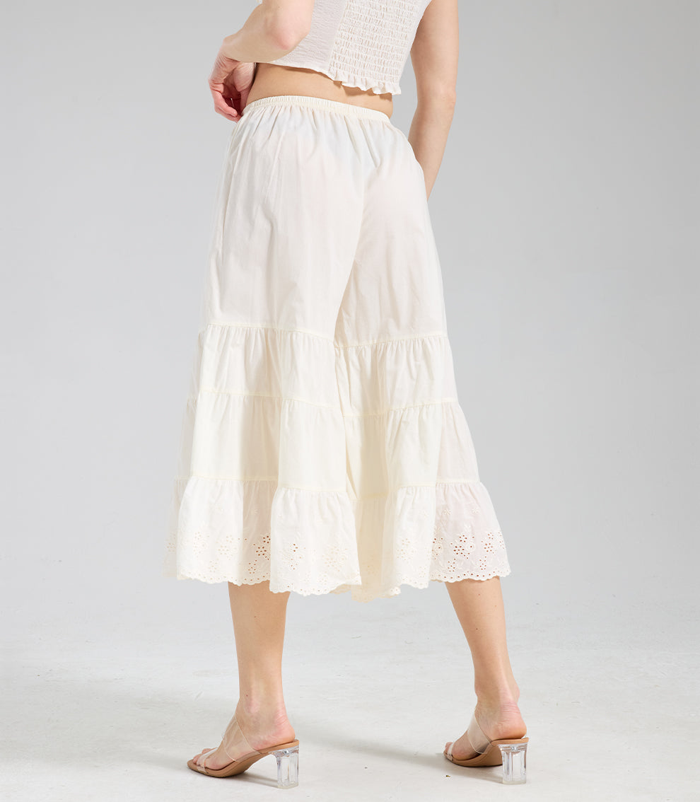 Back perspective of cream ruffle bloomers showing the multi-layered tiered design and comfortable fit.