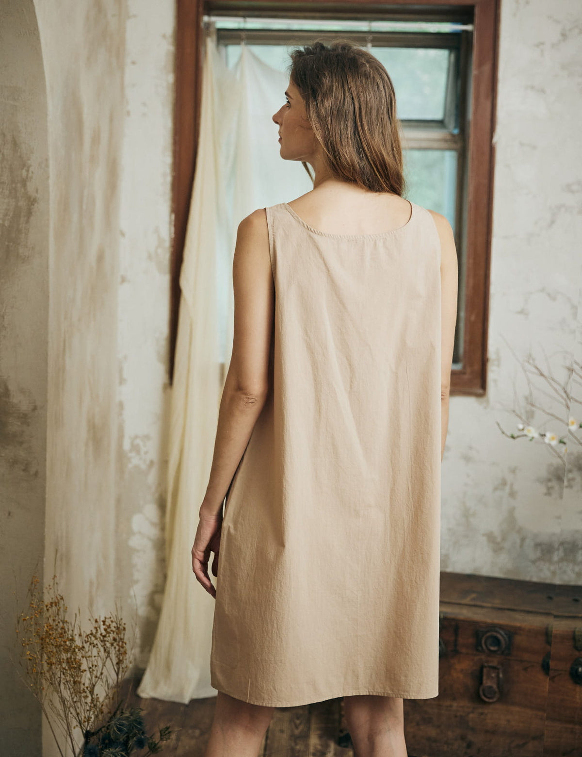 Back view of nude cotton full slip displaying the flowing silhouette and comfortable fit