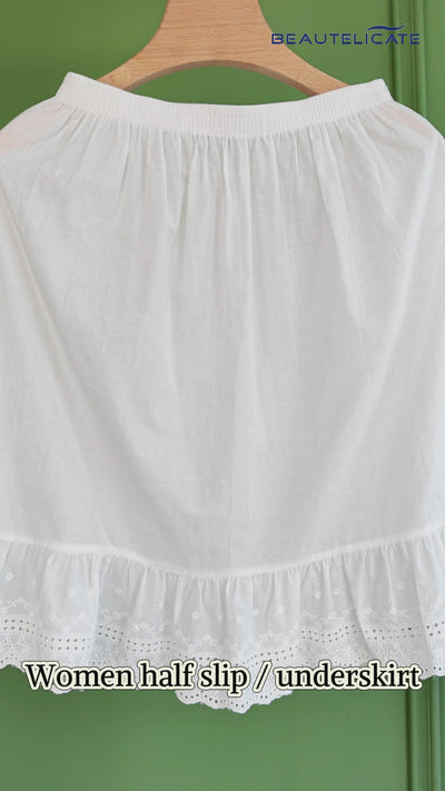 ivory vintage cotton half slip with elegant 5-inch lace trim, showing knee-length design